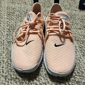 Pink Nike running shoes women’s size 8.5 warn but like new.